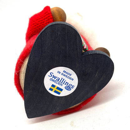 Bottom. Made in Sweden
(Image of the red coat tomte)